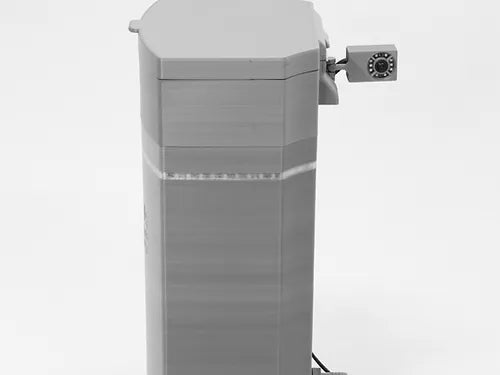 The Poly Lift ICON 2 is a gray, rectangular lift controller with a small, square camera on its upper right side, designed to provide real-time lift notifications. It stands upright against a plain white background.