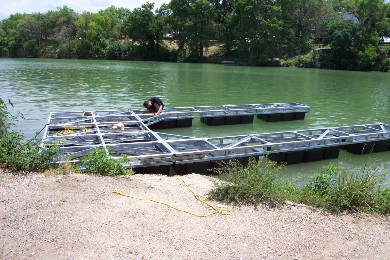 Photo of a boat lift being worked on in the water