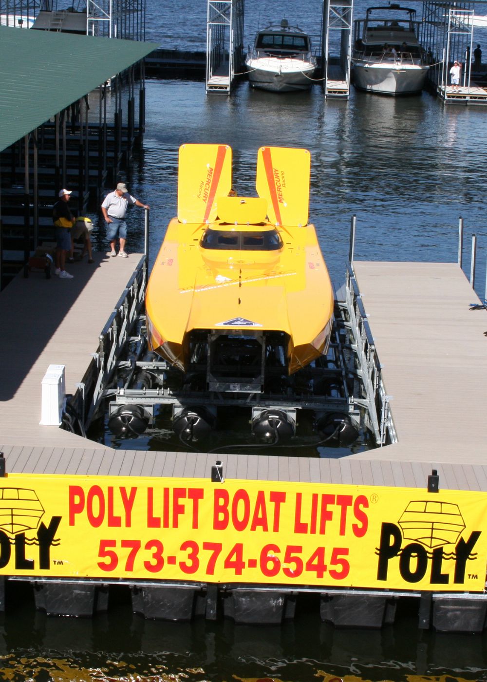 Front shot of ayellow boat on a PolyLift