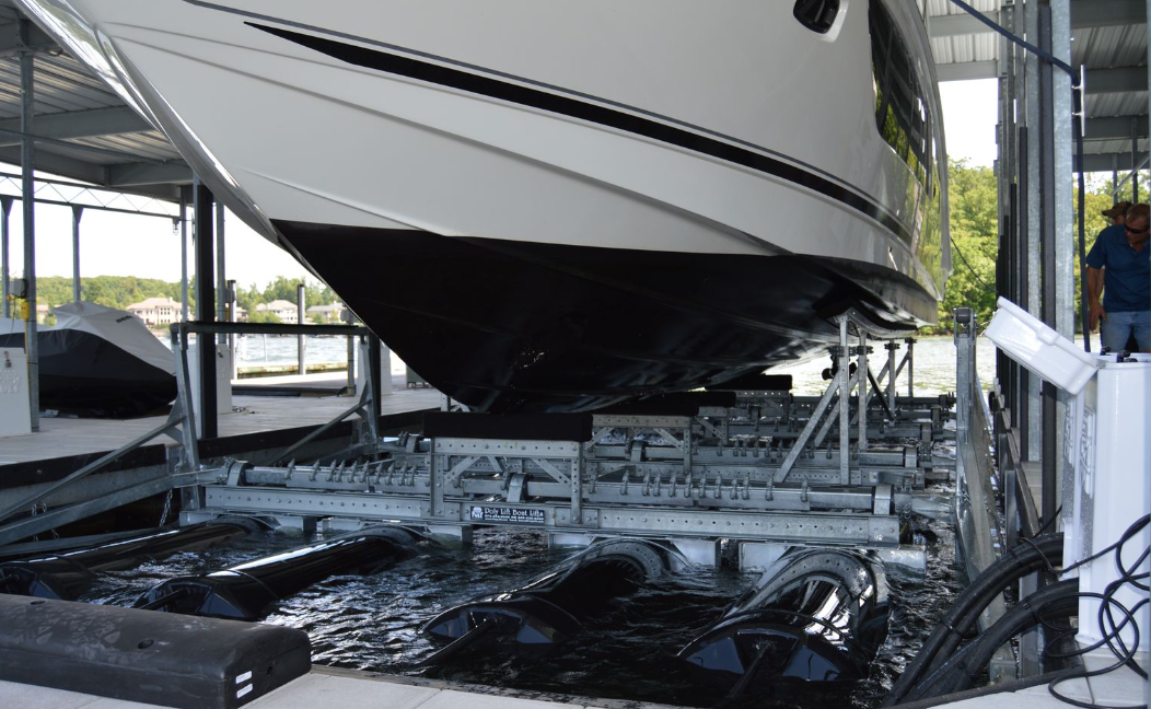 Shot of a PolyLift raising a massive boat with PolyLift logo showing
