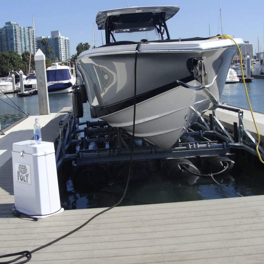 Photo of a PolyLift Control Unit on a dock with a boat behind it on a PolyLift