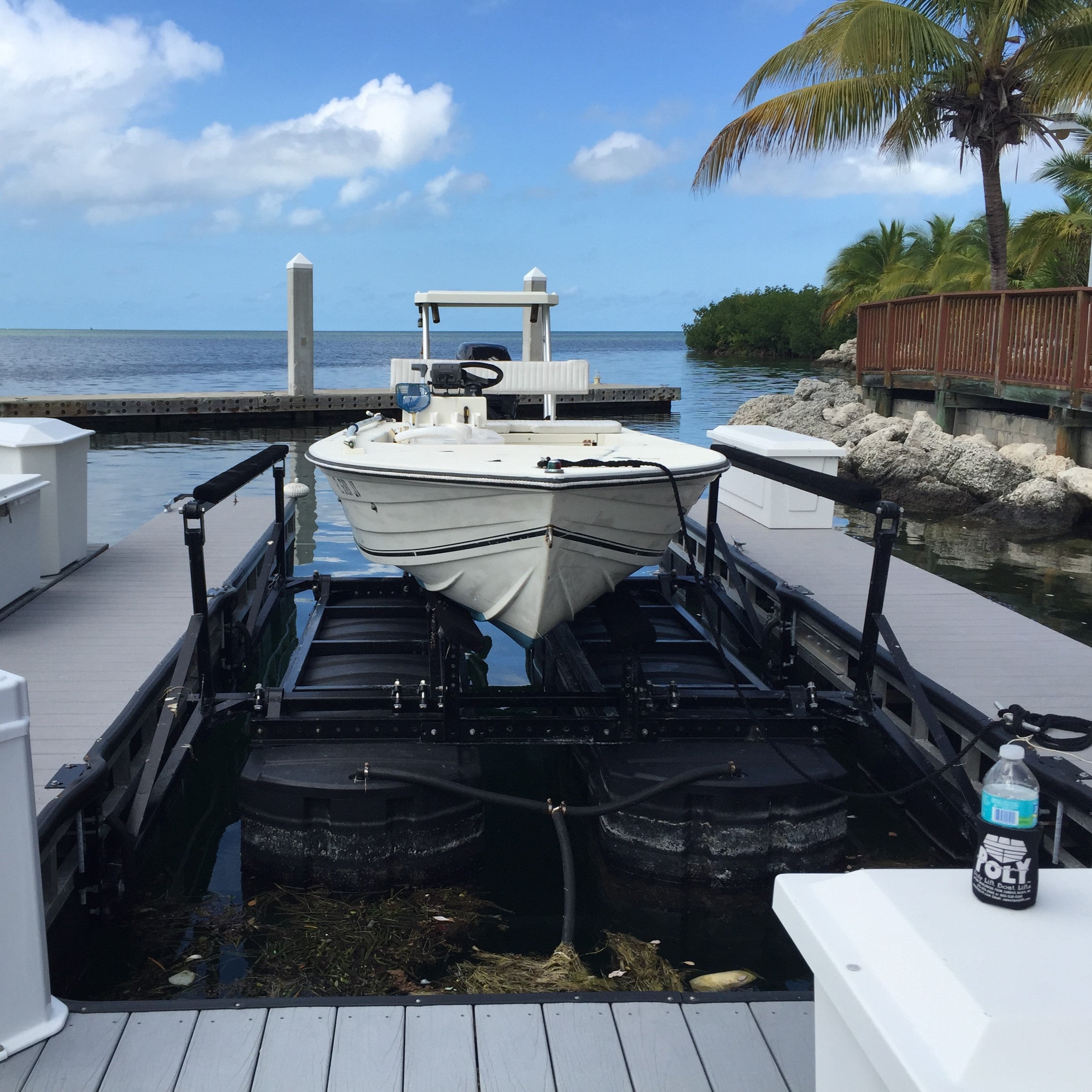 Photo of the Front of a Roto Lift with a boat on it