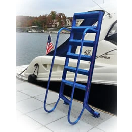 The WetStep EZ Stairs by Polylift, featuring ergonomic blue aluminum steps and handrails, is mounted to a dock beside a white boat and an American flag, with water and trees visible in the background.